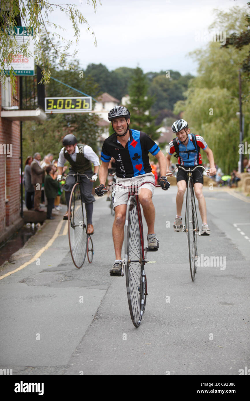 Knutsford Great Race held once every ten years. Penny Farthing Cycles race for three hours around Knutsford, Cheshire, England Stock Photo