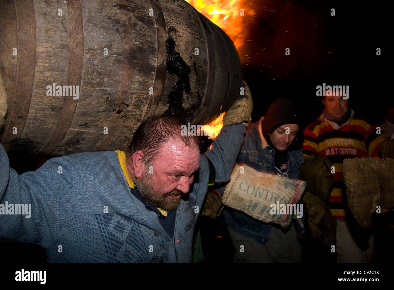 The quirky annual Carrying the Flaming Tar Barrels, held on Bonfire night in the small town of Ottery St Mary, in Devon, England Stock Photo