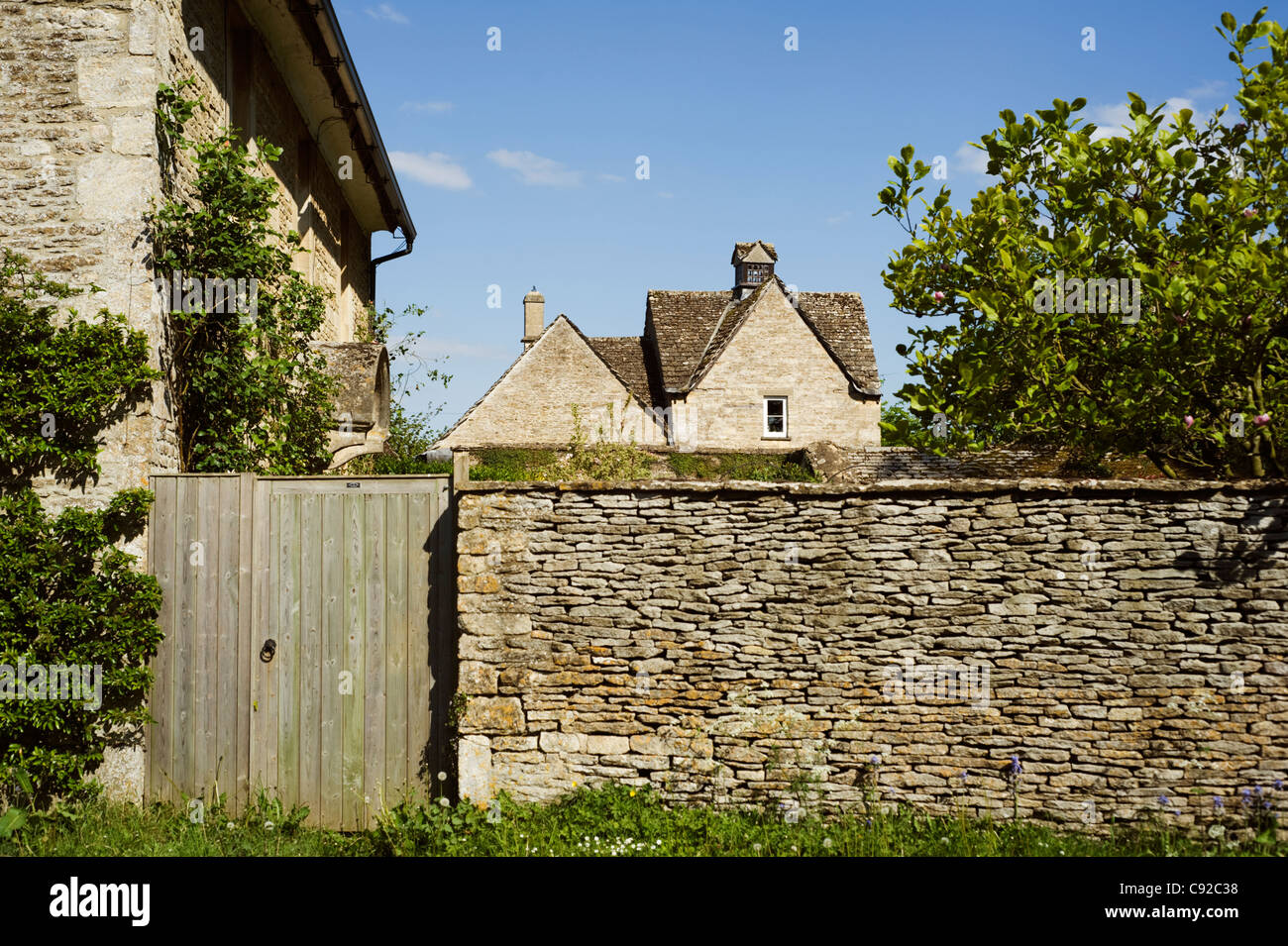 Many buildings and walls in the Cotswolds are built from the local limestone which has an attractive golden colour. Stock Photo