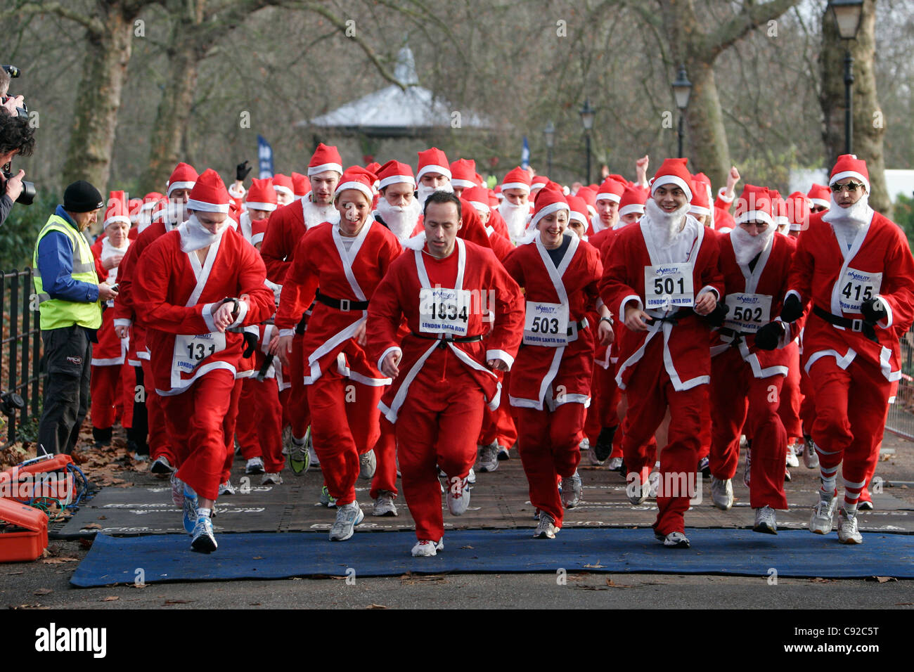 The quirky annual London Santa Run, held at the beginning of December, in Battersea Park, London, England Stock Photo