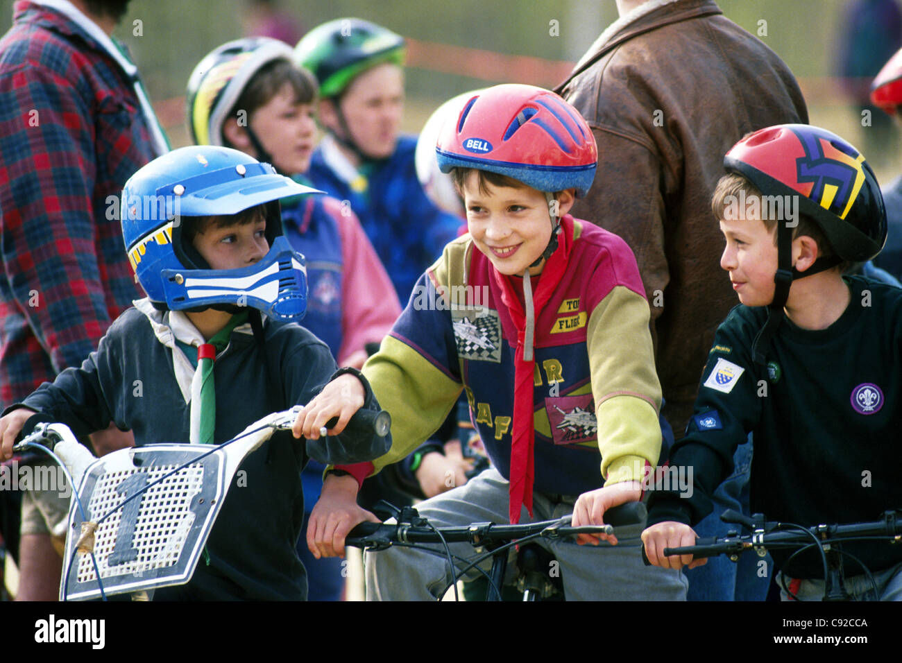 Generic images of children playing on bikes wearing safety helmets (photographer has statutory approval to work with children) for general editorial use Stock Photo