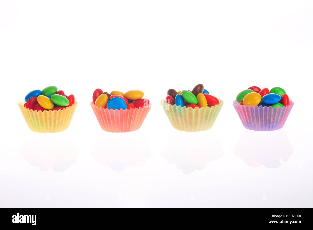 Candies fill in paper cup Stock Photo - Alamy