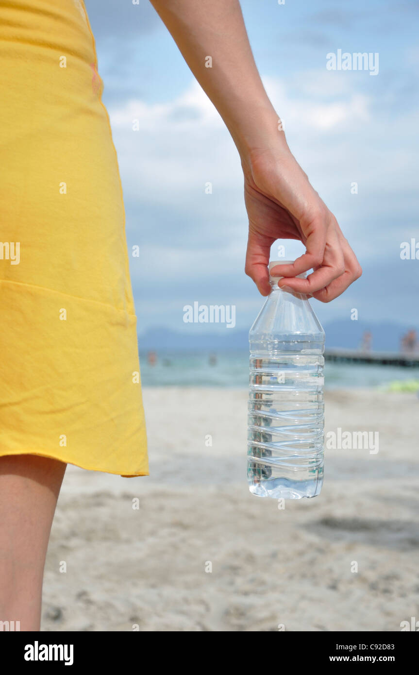 Young woman holding water bottle Stock Photo