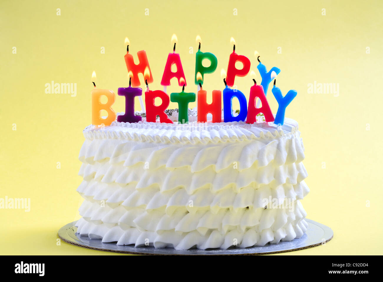 Birthday Cake with happy birthday candles Stock Photo - Alamy