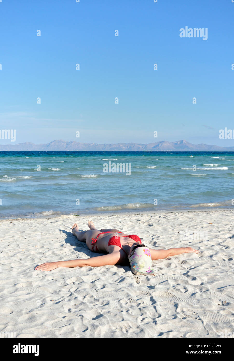 Woman sunbathing beach spain hi-res stock photography and images pic