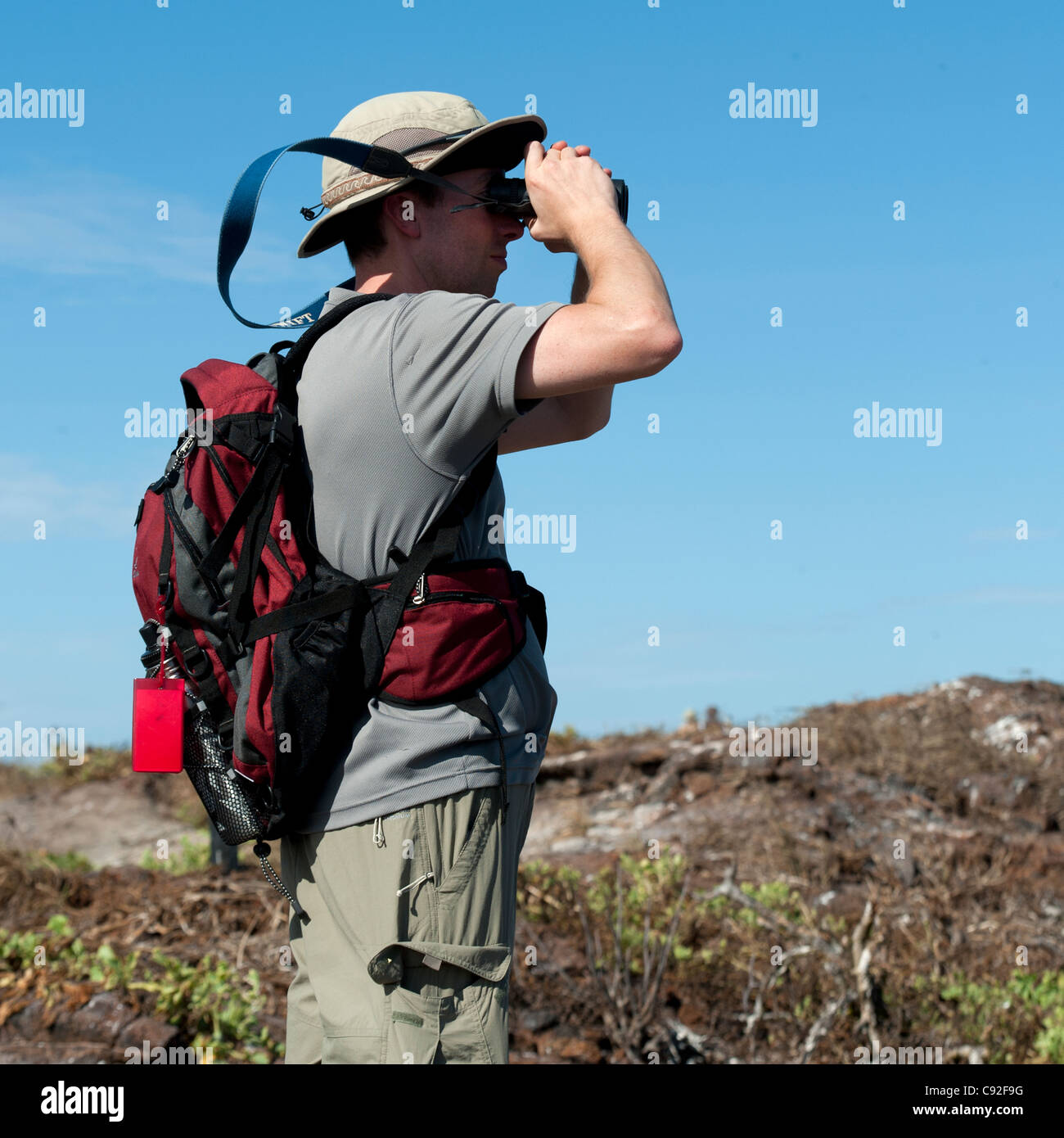Man looking through a binoculars, Prince Philip's Steps, Tower Island