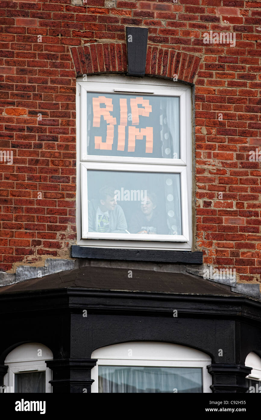 LEEDS, UK, 09/11/2011  A tribute to Sir Jimmy Savile in the window of a house in Consort Terrace, Woodhouse, Leeds, where Sir Jimmy spent his childhood. The funeral cortege passed along Consort Terrace on it's way to the funeral at St Anne’s Cathedral, Leeds. Stock Photo