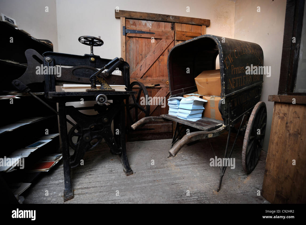 The Shambles Victorian Village in Newent, Gloucestershire - a museum of Victoriana UK 2009 - A printers press and cart. Stock Photo