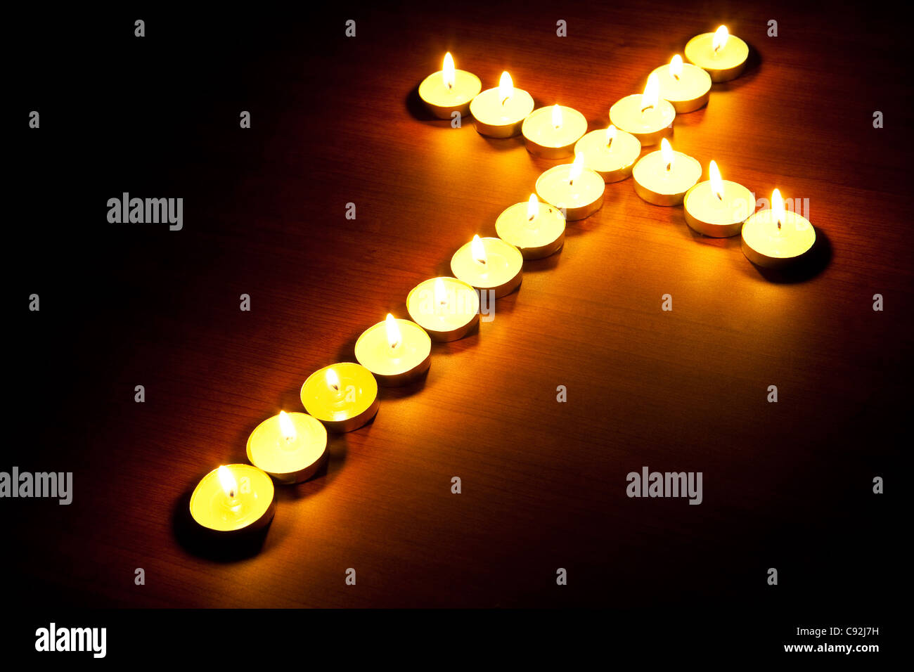 Cross made from church candle Stock Photo Alamy