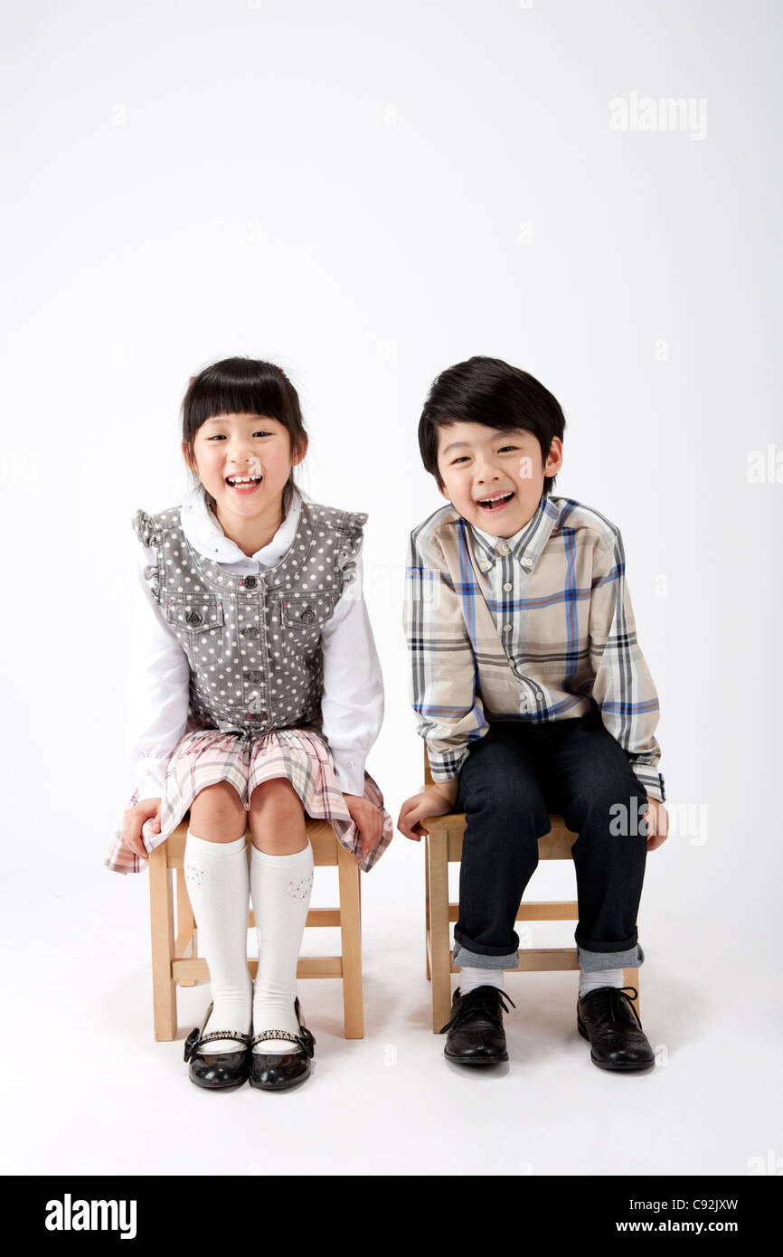 Boy sitting on stool hi-res stock photography and images - Alamy