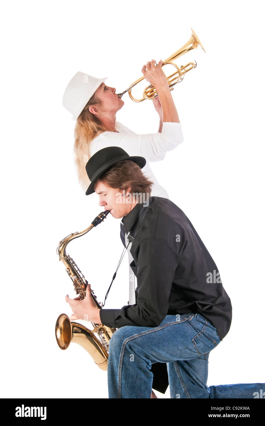 Mother and son playing jazz together with a trumpet and tenor saxophone. Stock Photo
