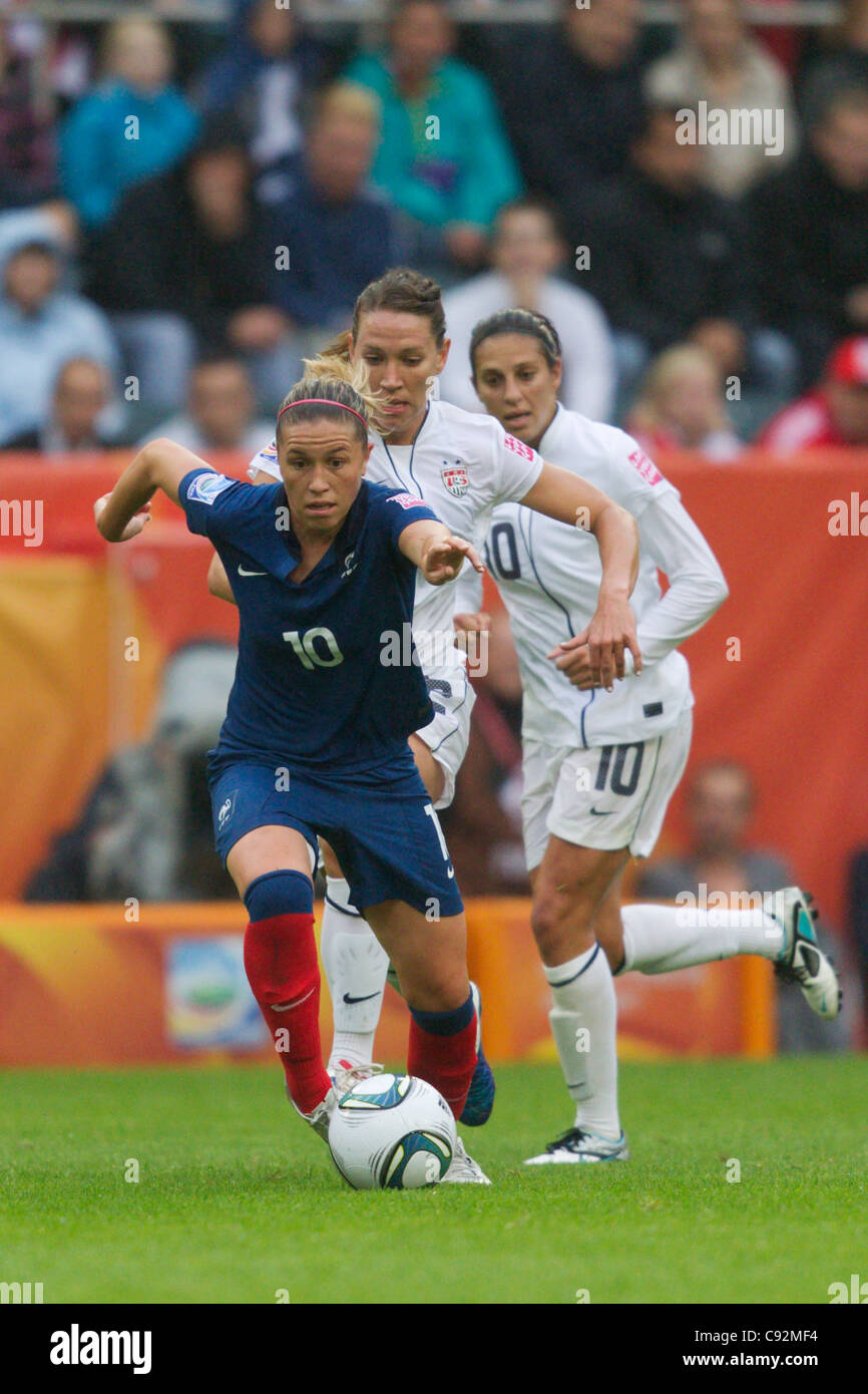 Camille Abily of France drives the ball against the United States during a 2011 FIFA Women's World Cup semifinal soccer match. Stock Photo