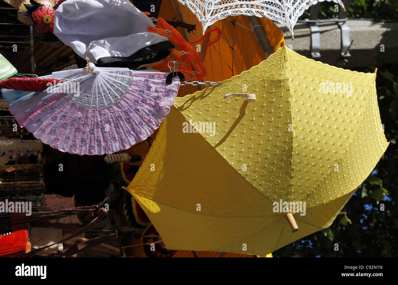 PINK LACE FAN & YELLOW PARASOL SEVASTOPOL CRIMEA UKRAINE 28 September 2011 Stock Photo