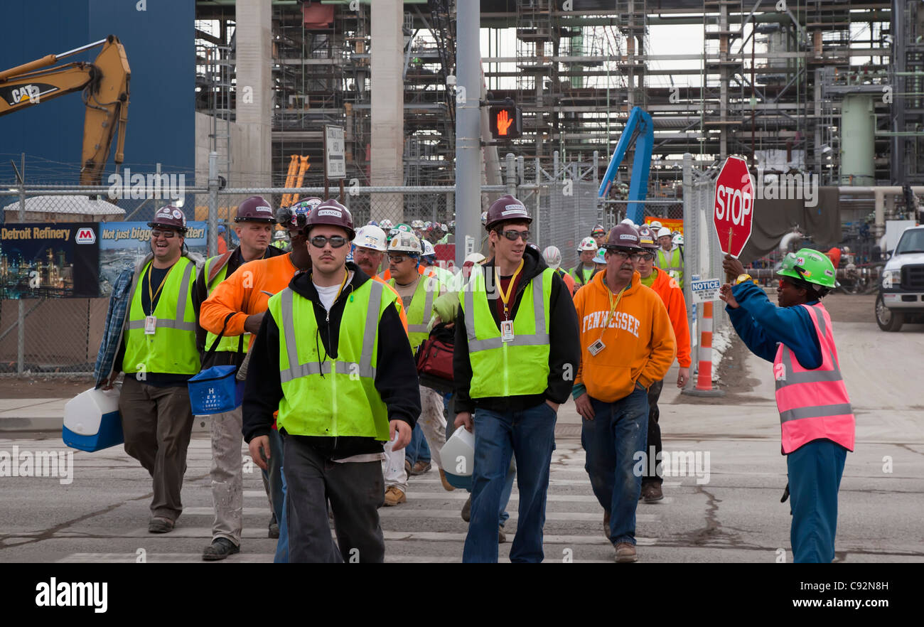Construction Workers Shift Change at Oil Refinery. They are expanding the refinery to process oil from Canada's tar sands. Stock Photo