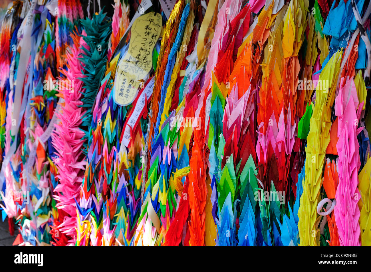 Paper cranes representing peace at Nagasaki Peace Park established in 1955 near the hypocentre of the 1945 World War Two atomic Stock Photo
