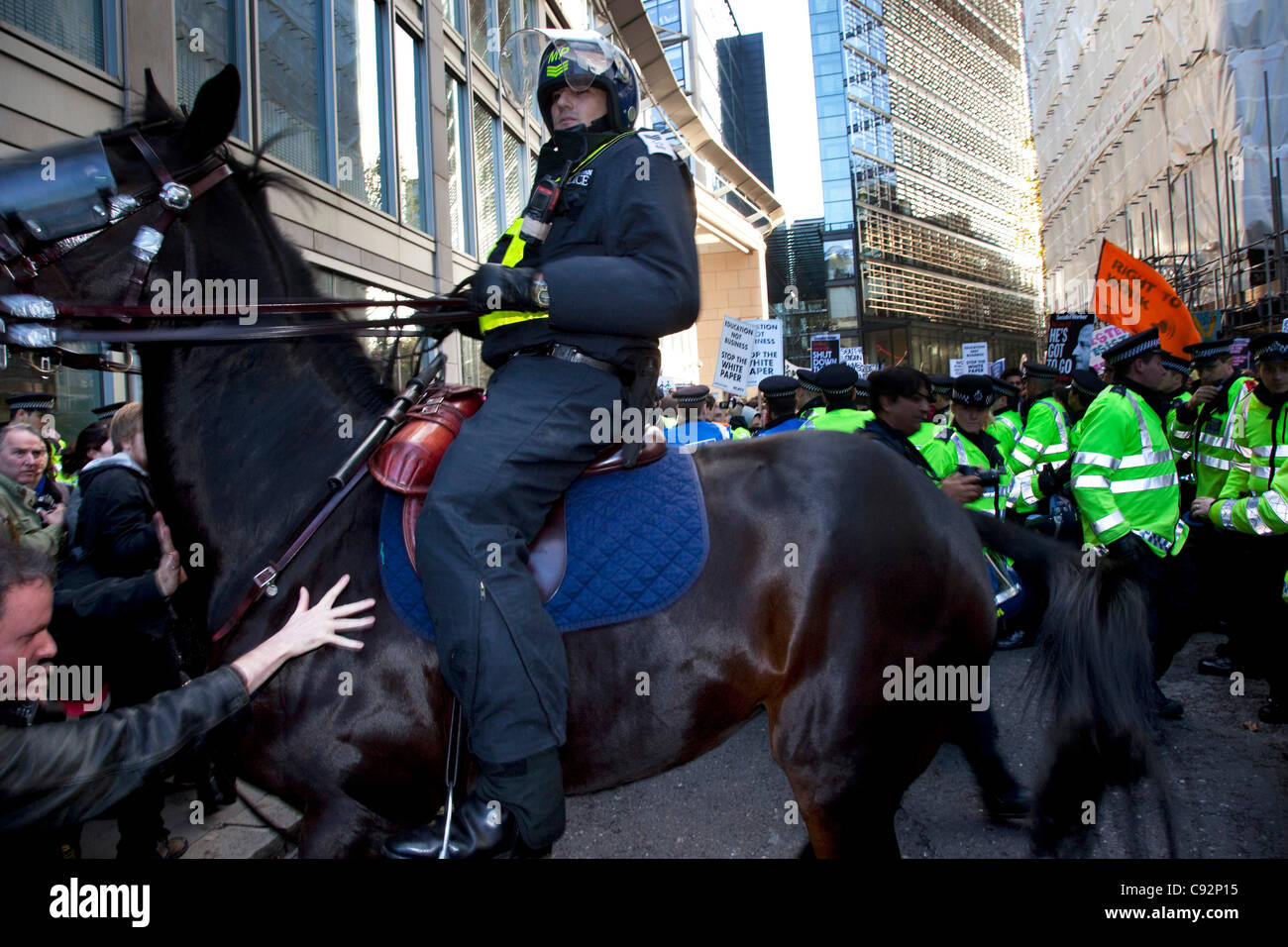 Police horses in riot gear are deployed as scuffles break out in The