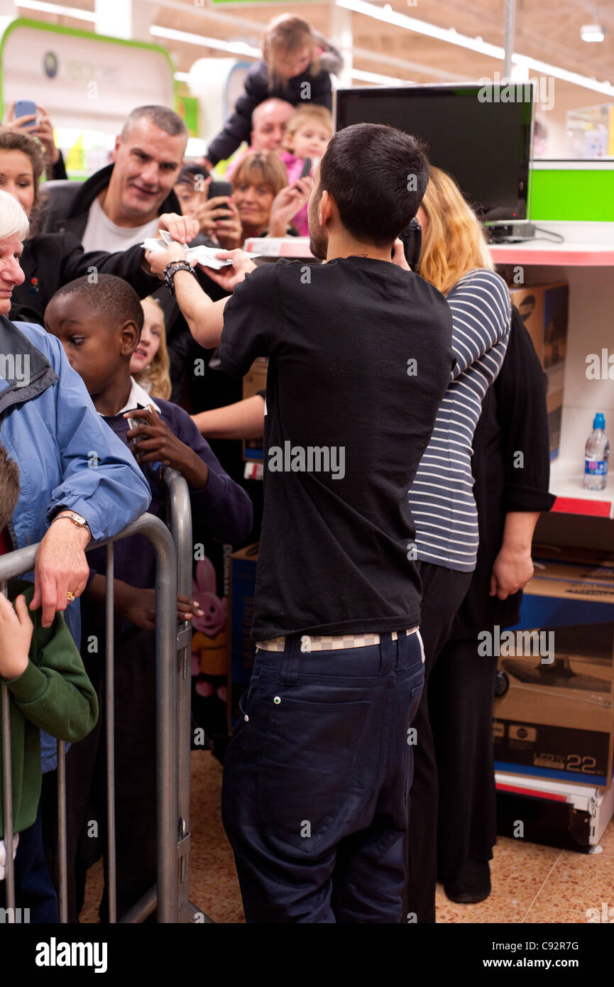 Dynamo meets waiting fans at Asda, Spondon, UK on the release of his ...