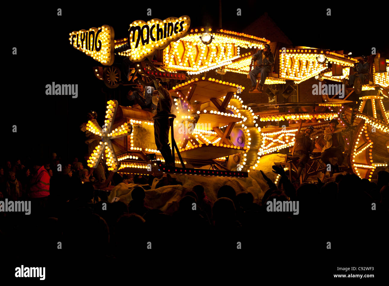 floats lit up at night with music playing during the bridgwater