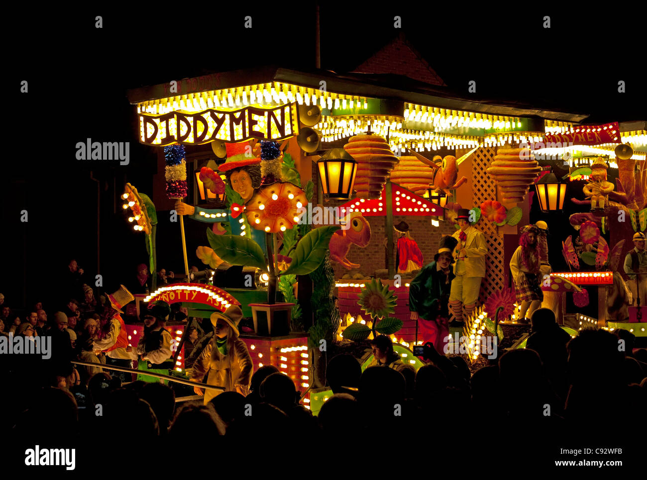 floats lit up at night with music playing during the bridgwater