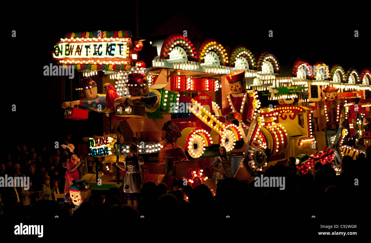 floats lit up at night with music playing during the bridgwater