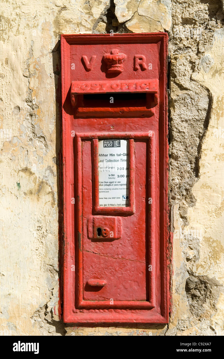 Evidence of Malta's close ties with Britain can be seen on this traditional british post box bearing the insignia of Queen Stock Photo