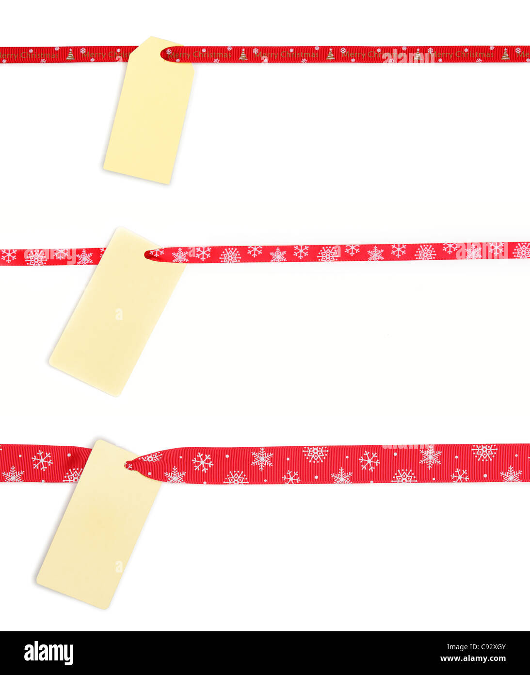 Collection of blank gift tag tied with red satin ribbon. Stock Photo