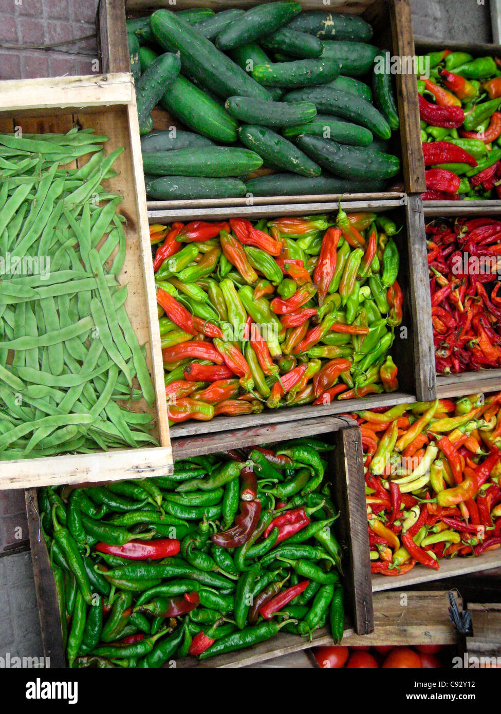 Montevideo, Montevideo, Uruguay Display of green cucumbers, chilies and beans. Stock Photo