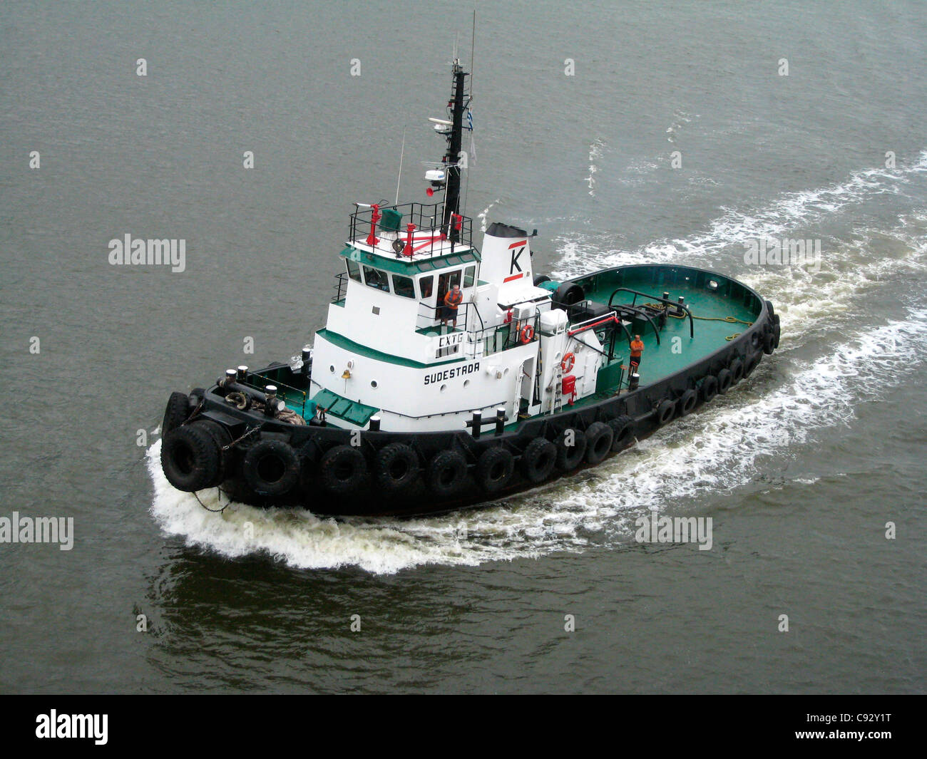 Montevideo, Montevideo, Uruguay Tug boat escorting ship with pilot on board. Stock Photo