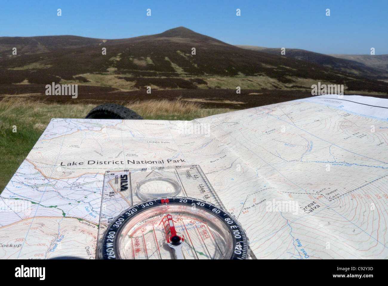 A map and compass in the Lake District Stock Photo Alamy