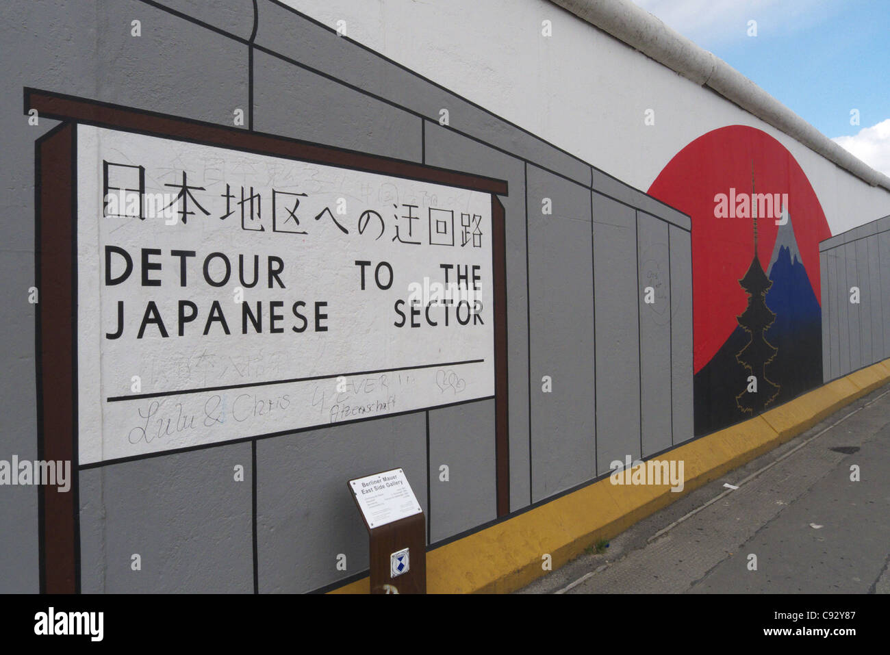 Wall Paintings saying 'detour to the Japanese Sector' on Eastside Gallery in Berlin Stock Photo
