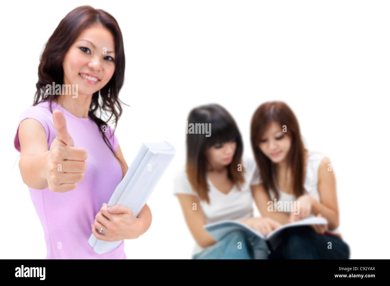 Female student thumbs up with great smile Stock Photo - Alamy