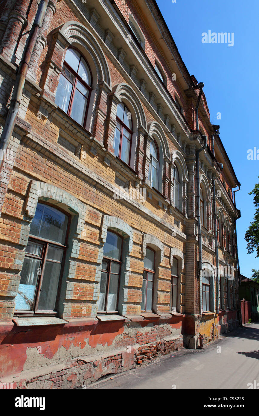 Old russian red bricks building offset against a deep blue sky Stock Photo