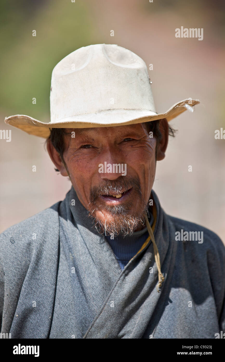 A farmer in the Chumey Valley wearing national dress, the gho. Stock Photo