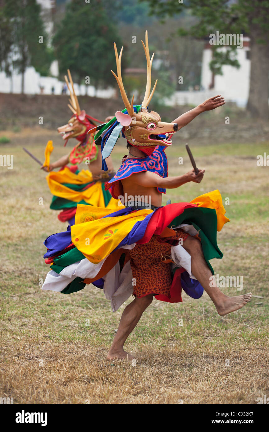 Dancers perform Shazam Tam, the Dance of the Four Stags outside Punakha Dzong. Stock Photo