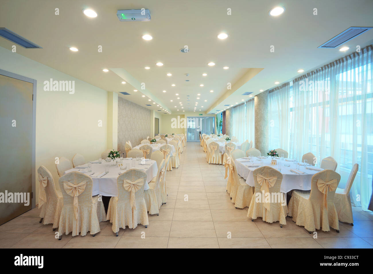 Interior of a restaurant prepared for wedding ceremony Stock Photo - Alamy