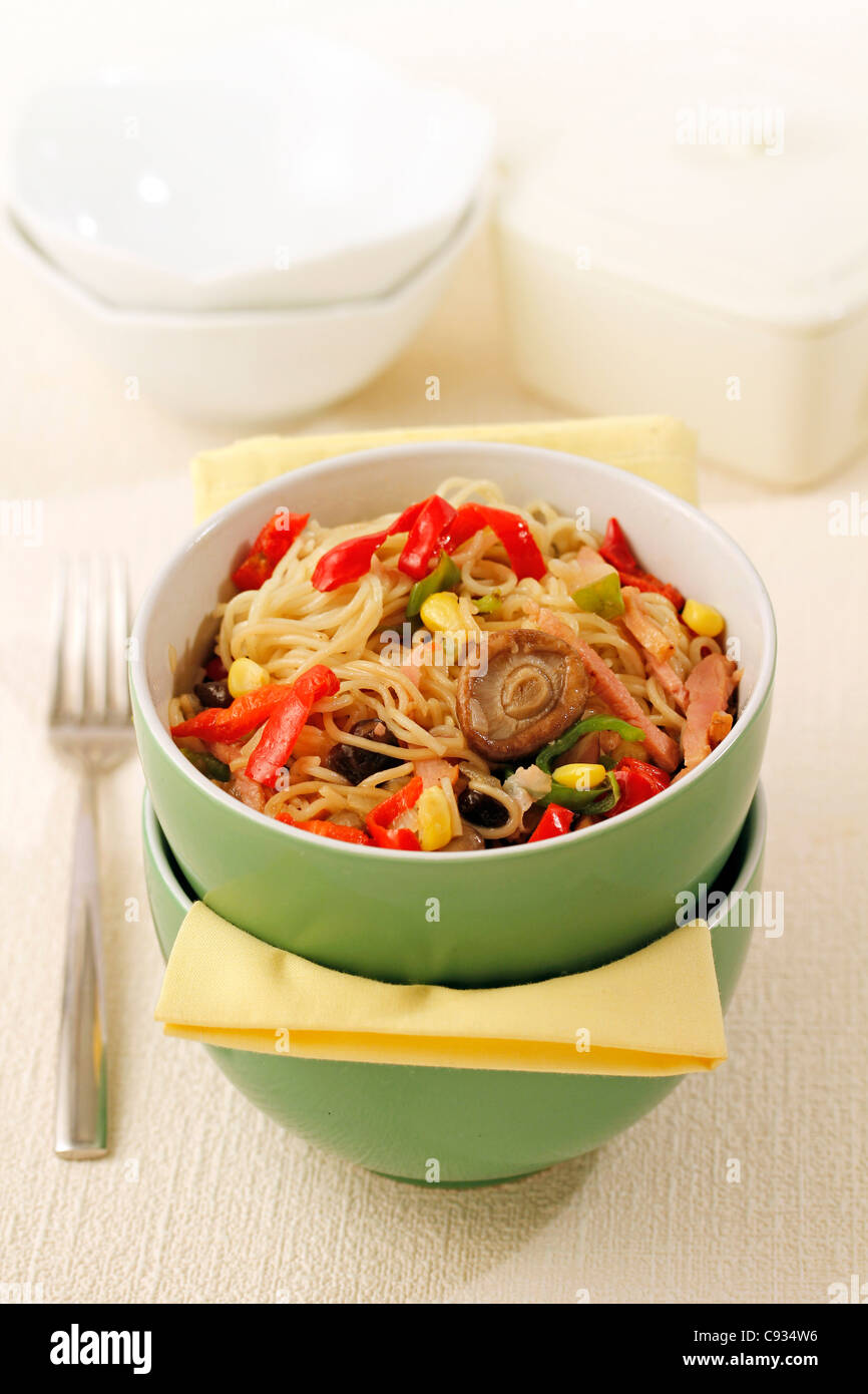 Sautéed Chinese noodles. Recipe available. Stock Photo