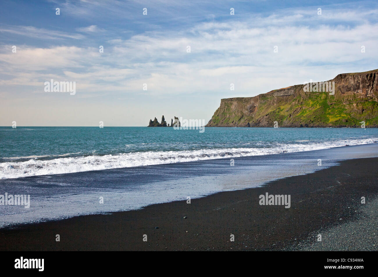 The beach at Vik with its long stretch of black basalt sand has been counted as one of the most alluring beaches on Earth. Stock Photo