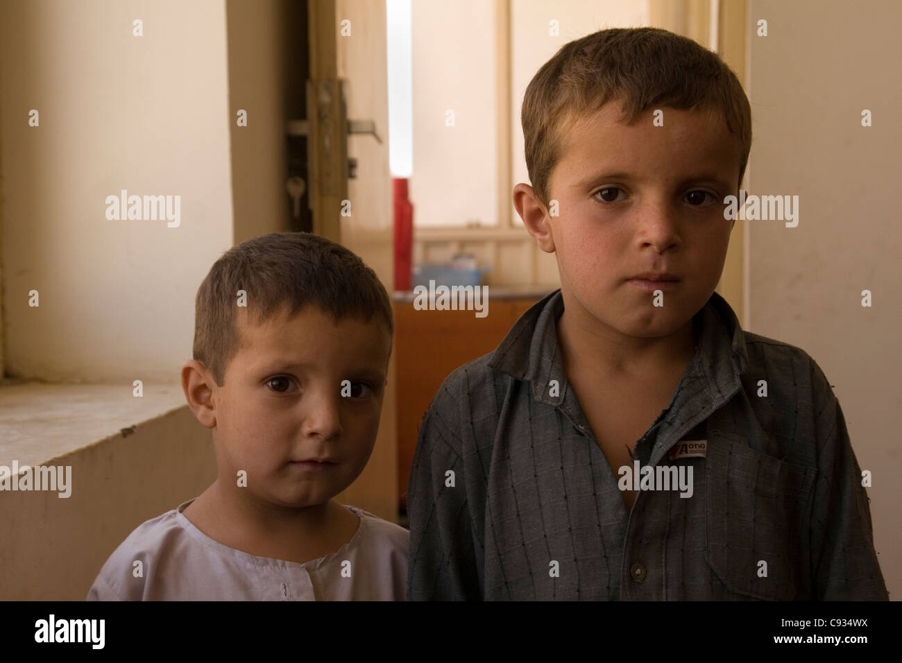 Afghan brothers living in a Red Crescent housing project in Kabul Afghanistan Stock Photo