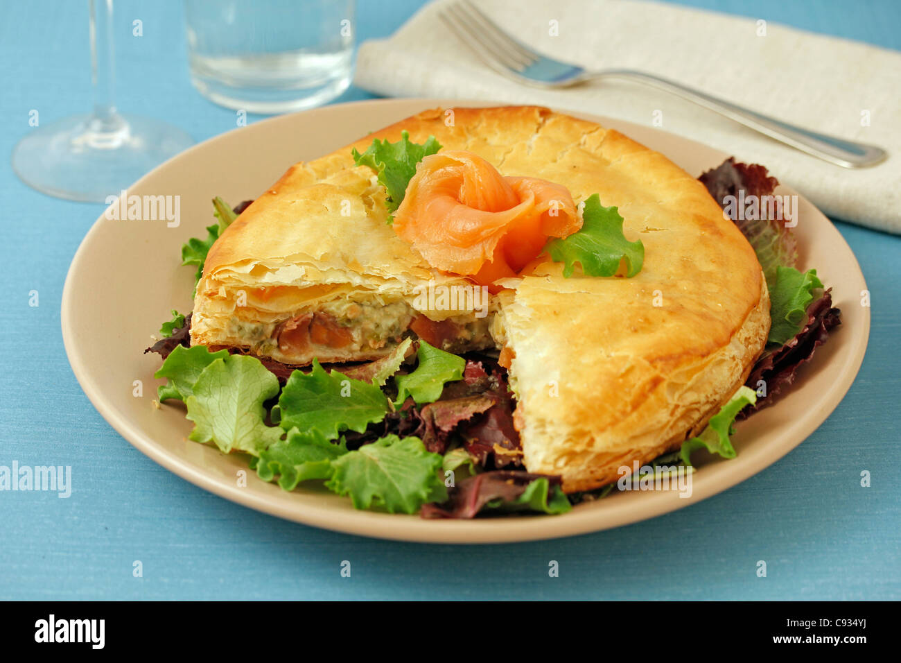 Puff pastry with salmon and scallops. Recipe available. Stock Photo