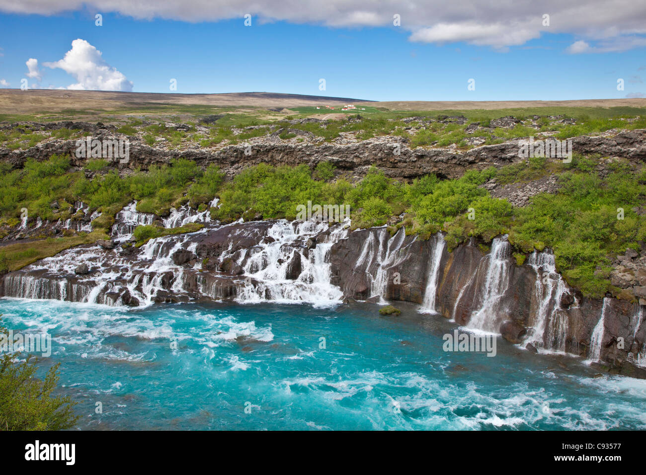 Hraunfossar, meaning Lava Falls is a series of waterfalls cascading into the glacier-fed Hvita River. Stock Photo