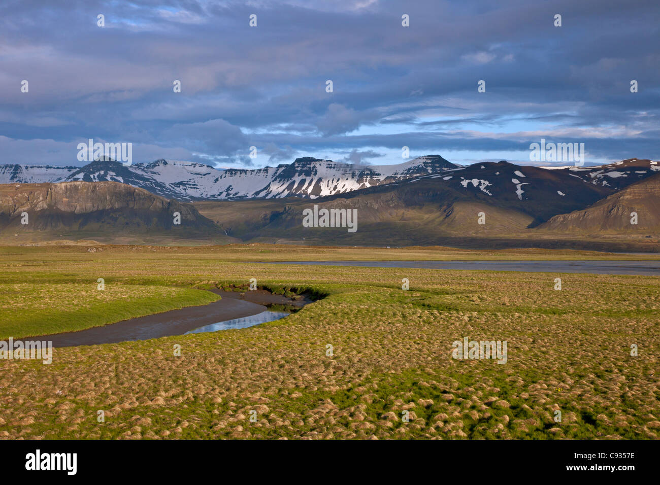 A view of beautiful snow-capped mountains in late evening sunshine, just outside Borgarnes. Stock Photo