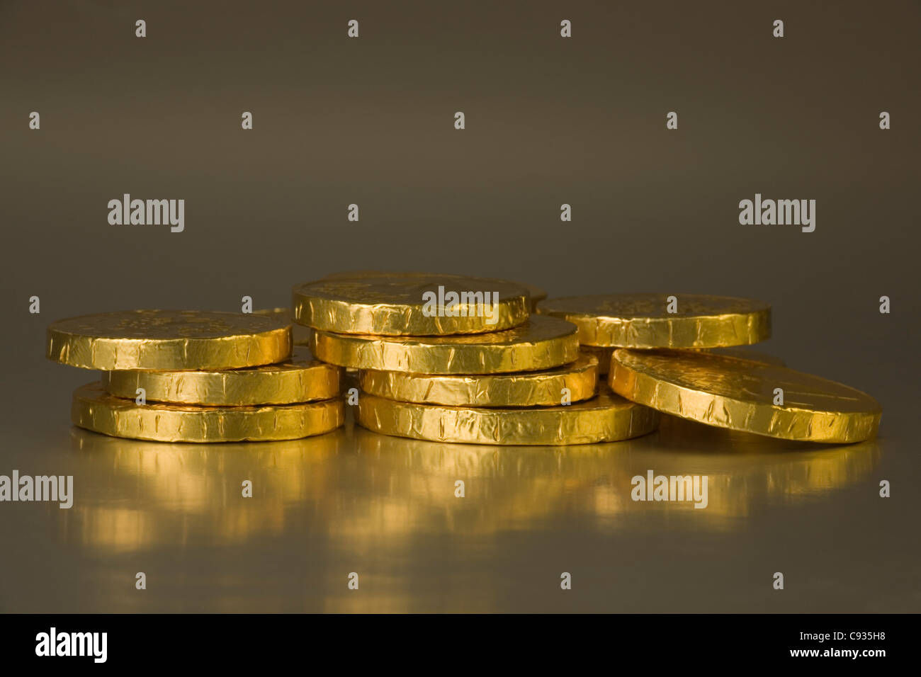 Gold coloured artificial coins, chocolate coins Stock Photo