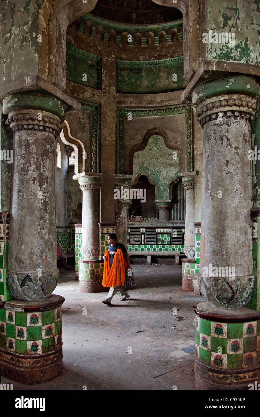 The dilapidated Zenana Bathing Ghat behind the busy Mullik Ghat flower market near Howrah bridge. Stock Photo