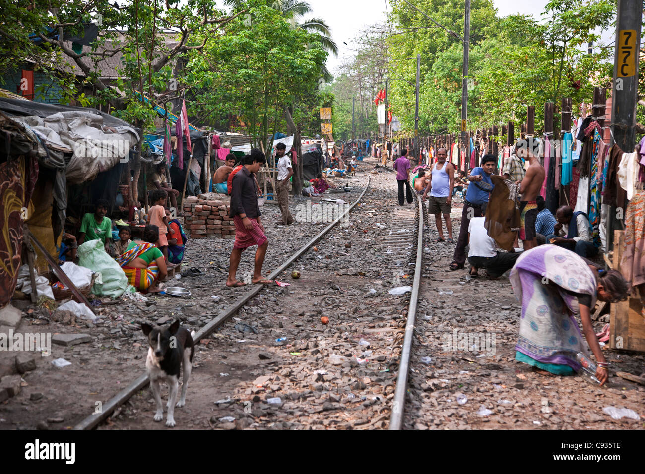 Large numbers of poor people live in shacks along railway lines on the outskirts of Kolkata. Stock Photo