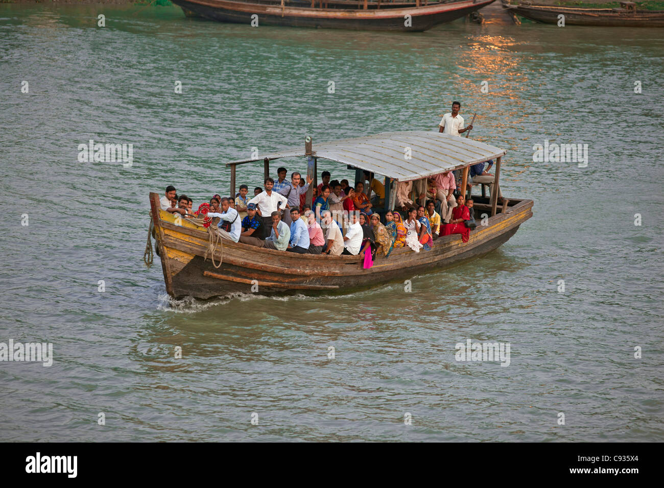 A crowded ferry crossing the Hooghly River, north of Kolkata. Stock Photo