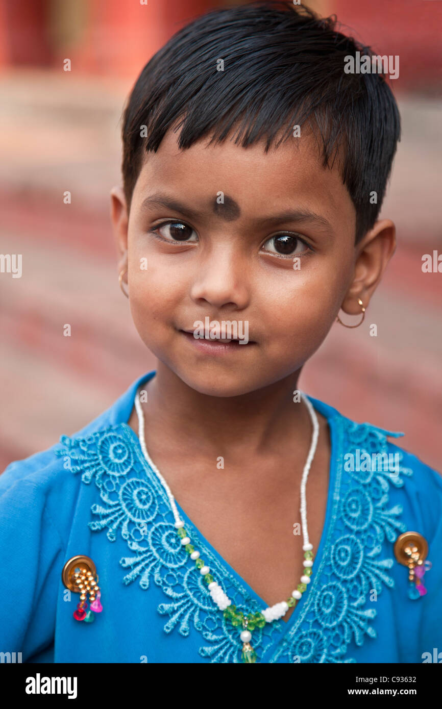 A young devotee at the Dakshineswar Kali Temple on the outskirts of Kolkata. The temple was founded in 1855 by Rani Rashmani. Stock Photo
