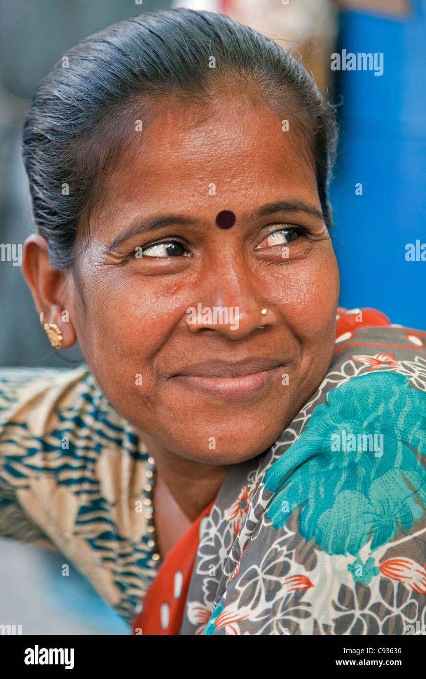 A happy woman at the Dakshineswar Kali Temple on the outskirts of Kolkata. The temple was founded in 1855 by Rani Rashmani. Stock Photo