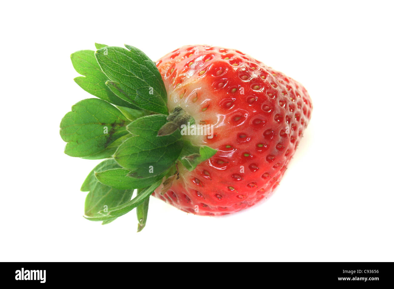 one red strawberry with green on a white background Stock Photo - Alamy