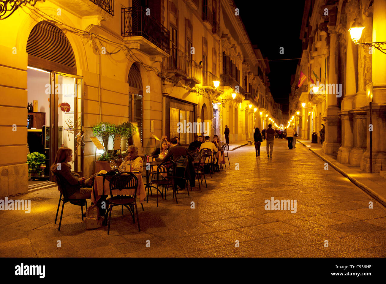 Sicily, Italy, Western Europe; People enjoying a drink outside in a typical Siclian bar, Trapani Stock Photo