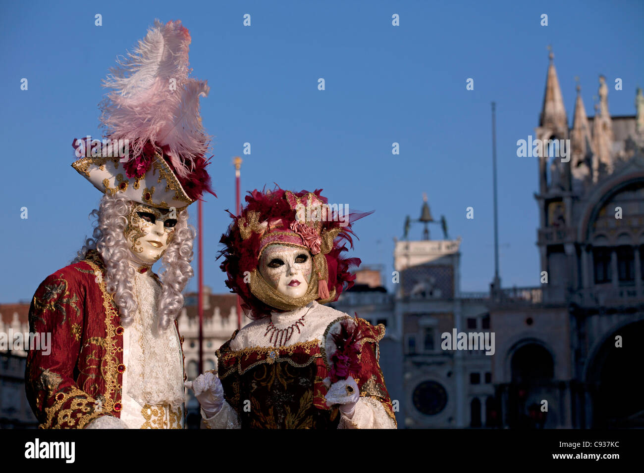 Venice, Veneto, Italy; A masked couple on Piazza San Marco Stock Photo